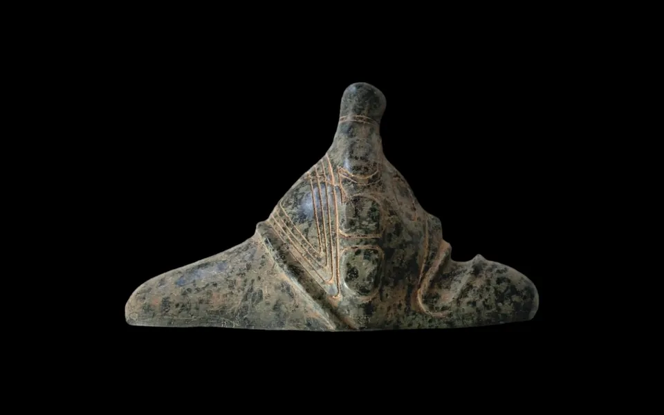 Carved stone three-pointer with incised decoration, Taíno, on black